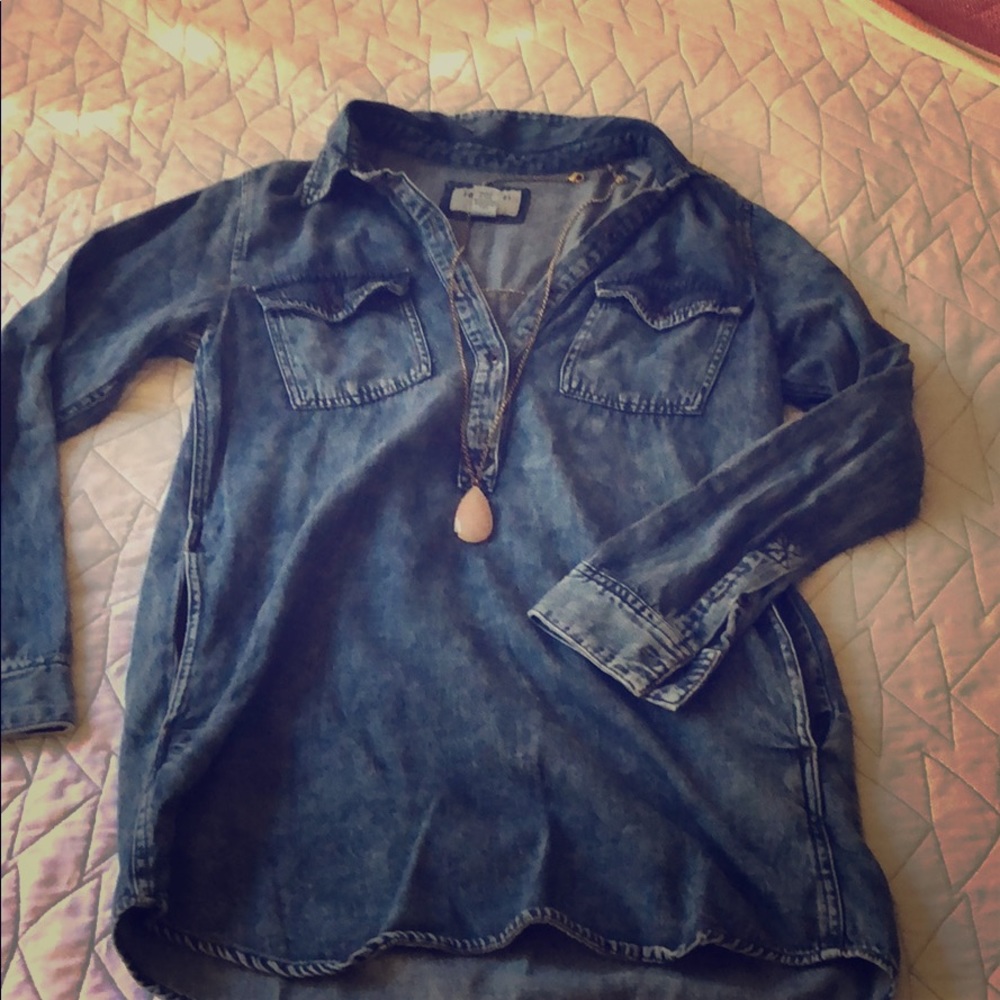 Denim shirt size medium runs small.  Forever 21.
